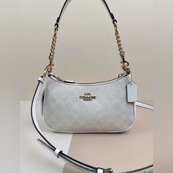 Coach Handbags - Coach White Shoulder Bag with Gold Accents